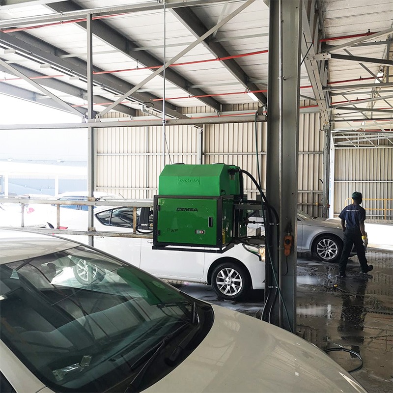Green Pressure Washer in a Car Wash Bay
