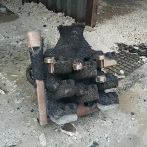 Wet sandblasting can be used to remove ceramic moulds from cast metal.